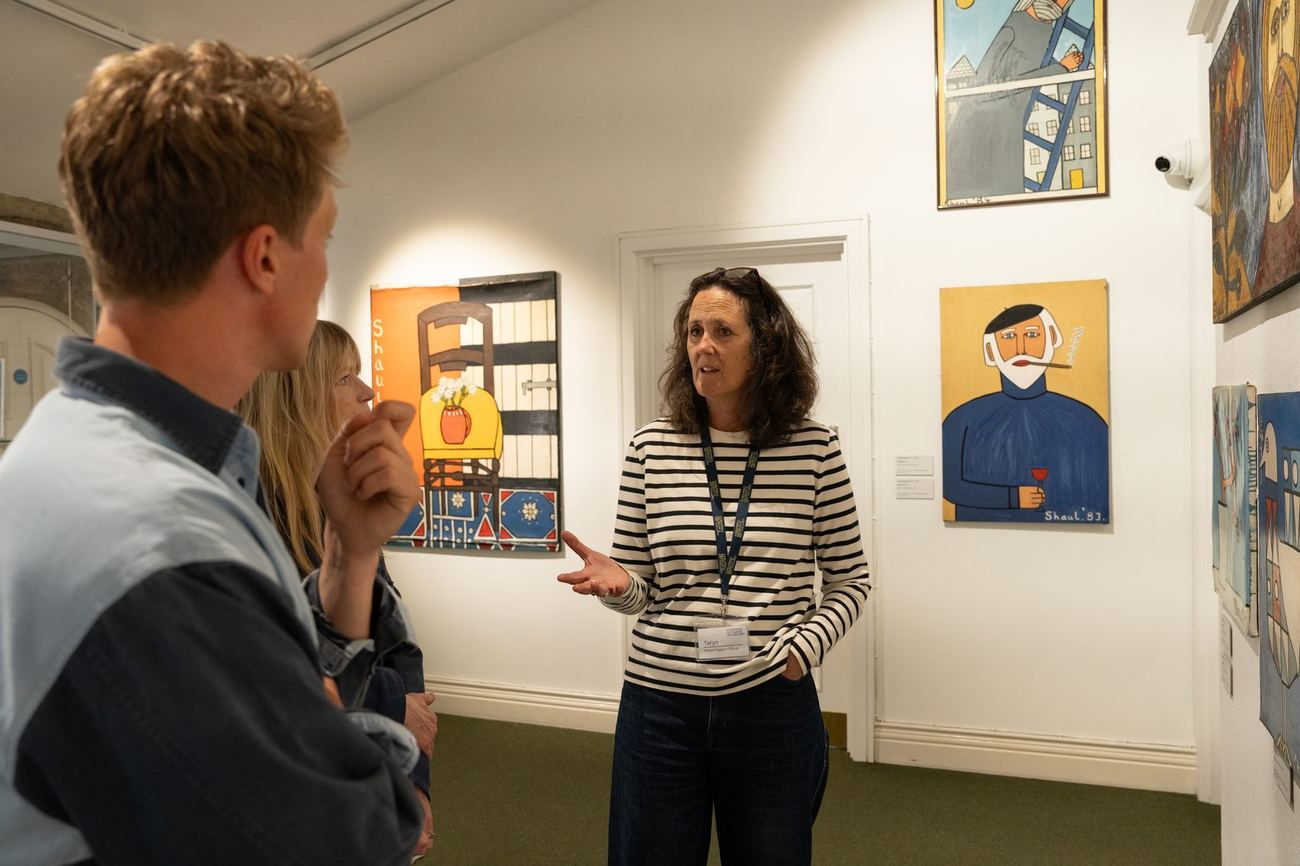 Visitors talking in the gallery