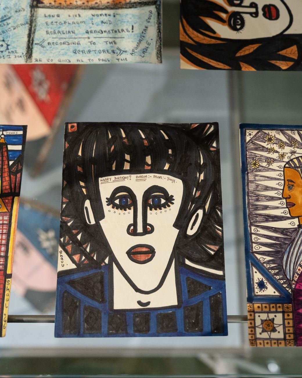 A painted face on the gallery wall